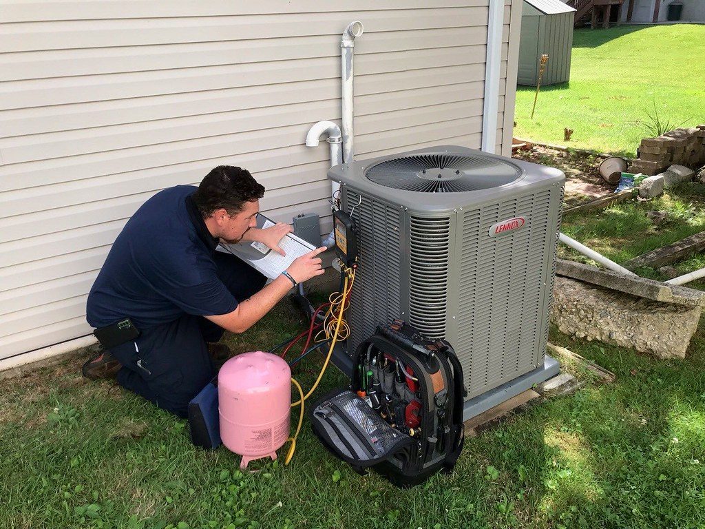 HVAC technician performing air duct cleaning in Clay, Alabama