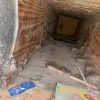 Dirty HVAC air duct before professional cleaning by DUCTS Air Duct Cleaning.