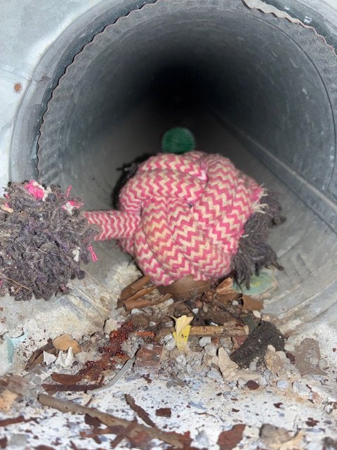 Round supply duct with debris before cleaning, Birmingham metro