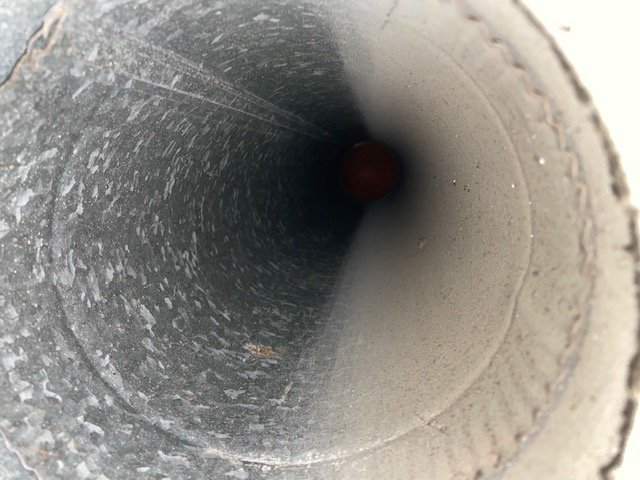 Round air duct interior before cleaning, Hoover, AL