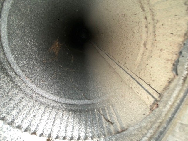 Round air duct with dust coating on interior walls, Hoover, AL
